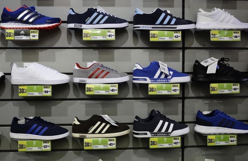 © Reuters. Adidas shoes are displayed in a Sports Direct store 