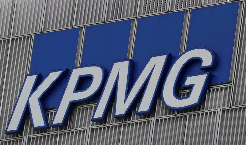 © Reuters. The KPMG logo is seen at their offices at Canary Wharf financial district in London