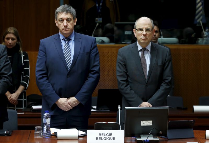 © Reuters. Belgian Interior Minister Jan Jambon and Justice Minister Koen Geens observe a minute of silence to victims of Tuesday's bombings during an extraordinary meeting of European Union interior and justice ministers in Brussels