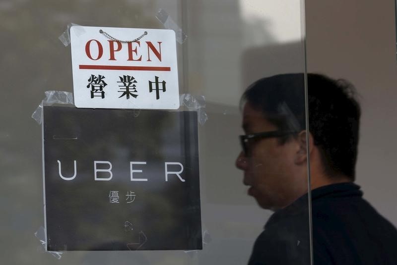 © Reuters. An open sign is seen at the office of taxi-hailing service Uber Inc during a driver recruitment event in Hong Kong