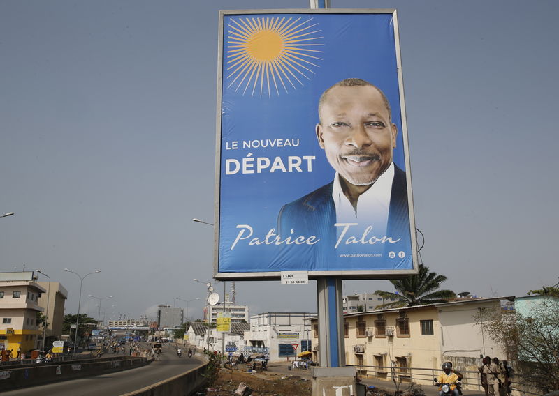 © Reuters. A billboard campaigning for presidential candidate, Talon, is seen along a road in the Akpakpa district in Cotonou