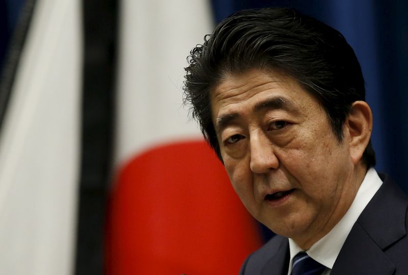 © Reuters. Japan's Prime Minister Shinzo Abe speaks at a news conference in Tokyo a day before Japan remembers the victims of the March 11, 2011 triple disaster