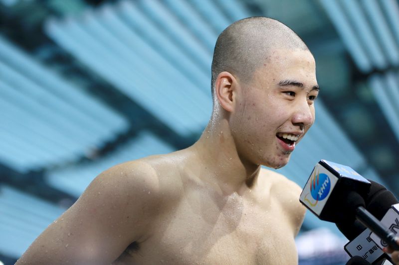 © Reuters. Wang Lizhuo is interviewed during the men's 100-meter breaststroke final at China's 2015 National Championships in Huangshan