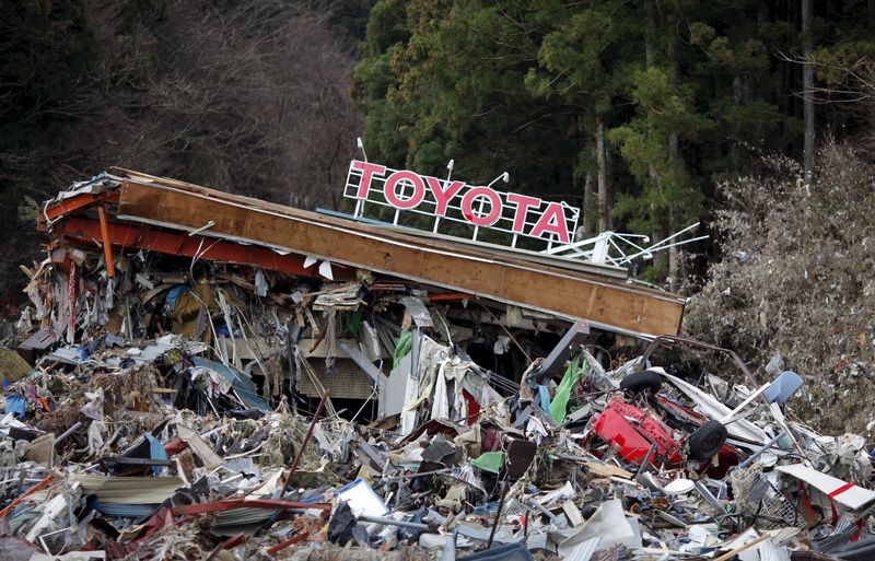 © Reuters. File photo shows a Toyota dealership is seen at a devastated area after the earthquake and tsunami, in Minamisanriku town, Miyagi prefecture