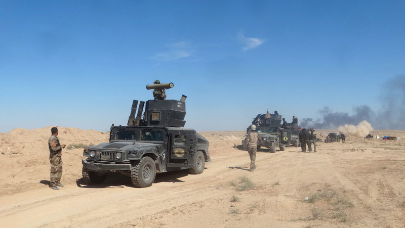 © Reuters. القوات العراقية تتقدم صوب بلدة غربية تسيطر عليها الدولة الإسلامية