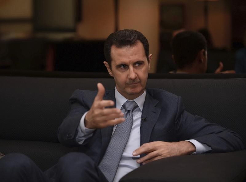 © Reuters. الأسد يقول إن الشعب السوري غير مهتم بموعد مغادرة القوات الروسية