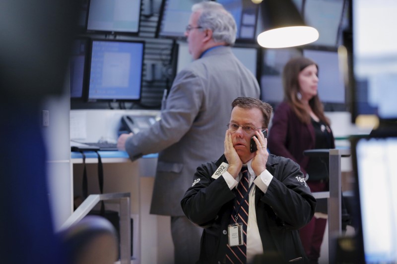 © Reuters. A trader works on the floor of the New York Stock Exchange shortly after the opening bell in New York