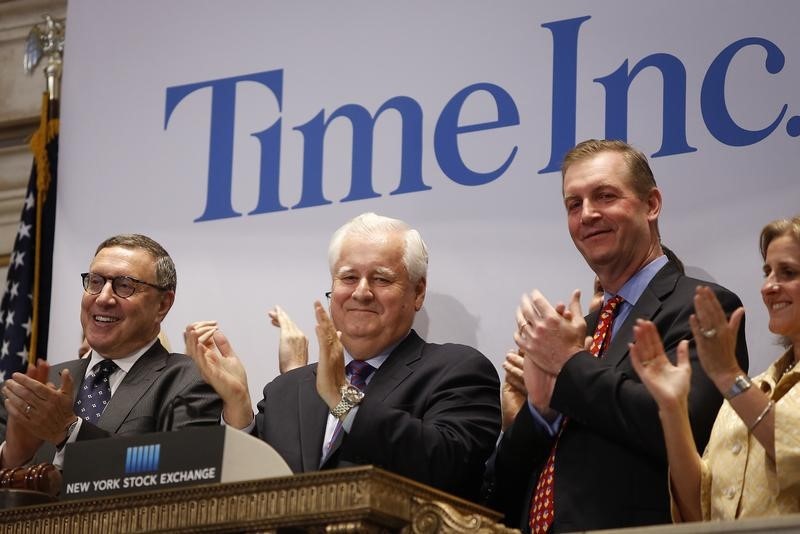 © Reuters. Time Inc. CEO Joe Ripp claps after ringing the bell to open trading at the New York Stock Exchange