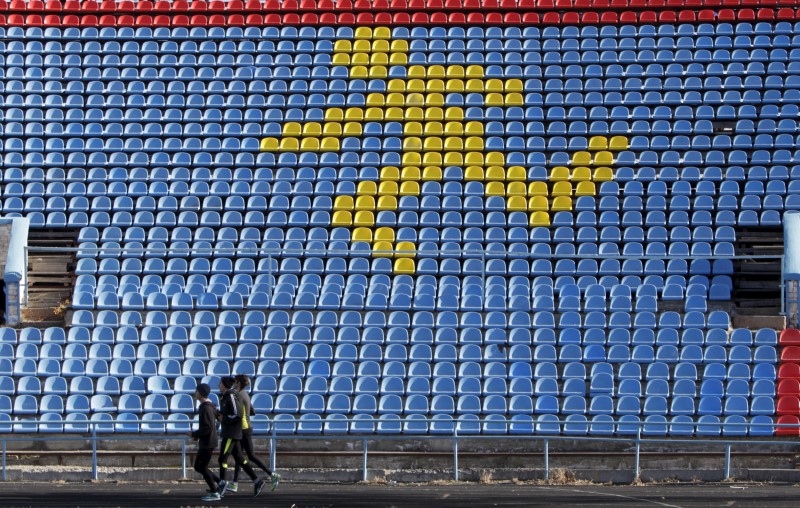 © Reuters. Sportsmen train at a local stadium in the southern city of Stavropol