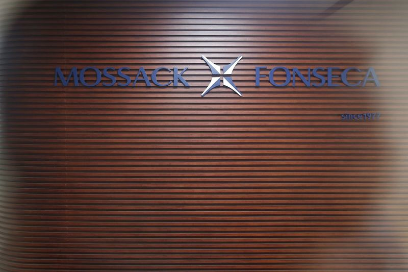 © Reuters. The company logo of Mossack Fonseca is pictured through a glass door inside the office of Mossack Fonseca at the financial district of Pudong in Shanghai