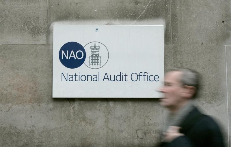 © Reuters. A pedestrian walks past Britain's National Audit Office in London