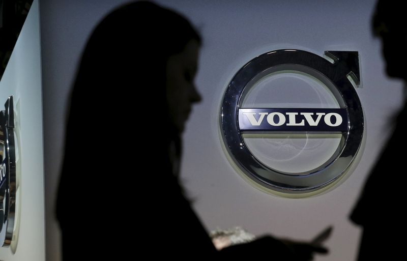 © Reuters. File picture of people seen in silhouette near the Volvo auto stand during the media preview of the 2016 New York International Auto Show in Manhattan, New York 