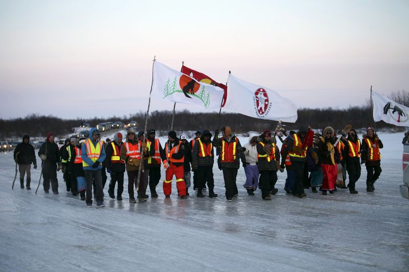 © Reuters. Youths from three First Nations communities cross the frozen Attawapiskat river during a march in support of efforts to tackle a sharp rise in suicide rates in Attawapiskat