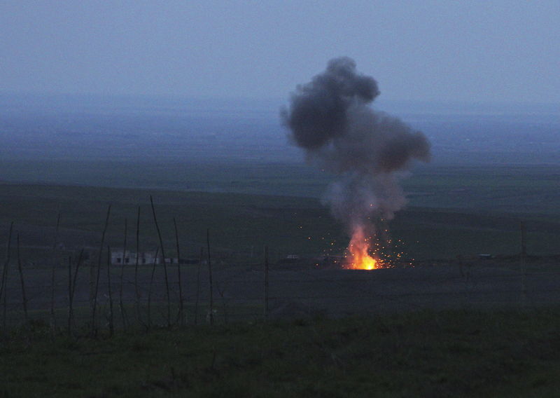 © Reuters. Smoke from fire rises above the ground in Martakert province, after an unmanned military air vehicle was shot down by the self-defense army of Nagorno-Karabakh according to Armenian media, during clashes over the breakaway Nagorno-Karabakh region