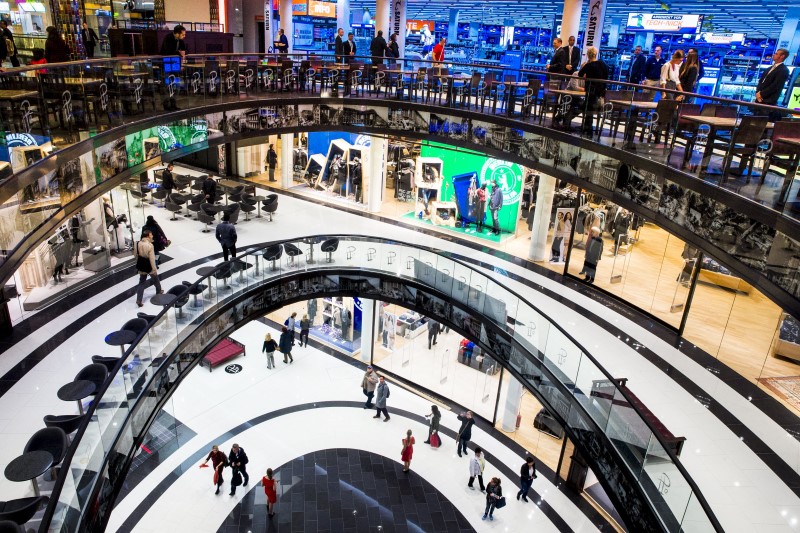 © Reuters. File photo of people walking through the Mall of Berlin shopping centre during its opening night in Berlin