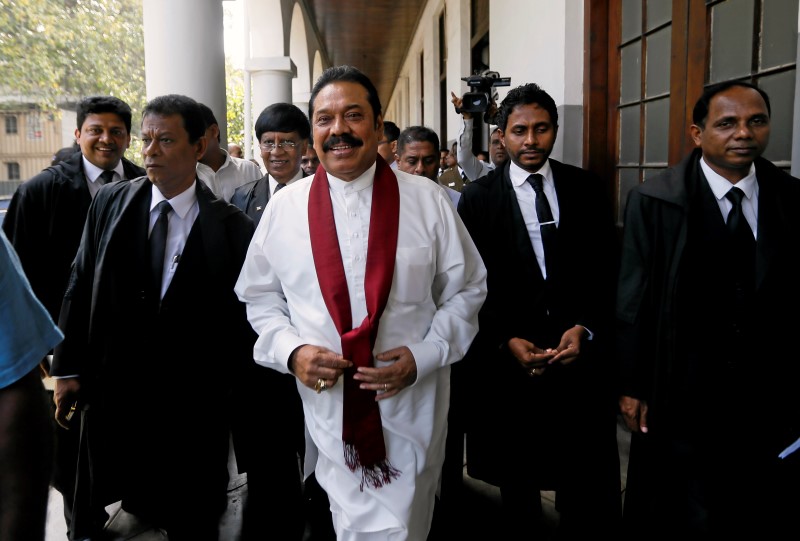 © Reuters. Sri Lanka's former President Rajapaksa arrives at the High Court to attend a hearing for a bail application for his son Yoshitha, who has been arrested under the country's money laundering act, in Colombo 