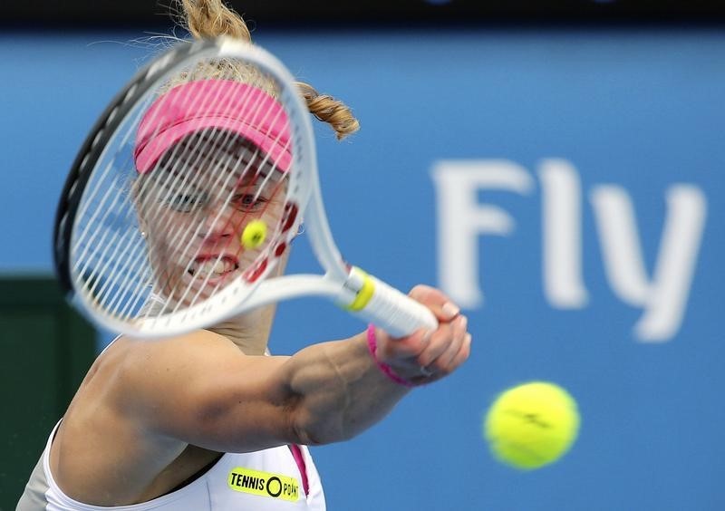 © Reuters. Germany's Siegemund hits a shot during her third round match against compatriot Beck at the Australian Open tennis tournament at Melbourne Park