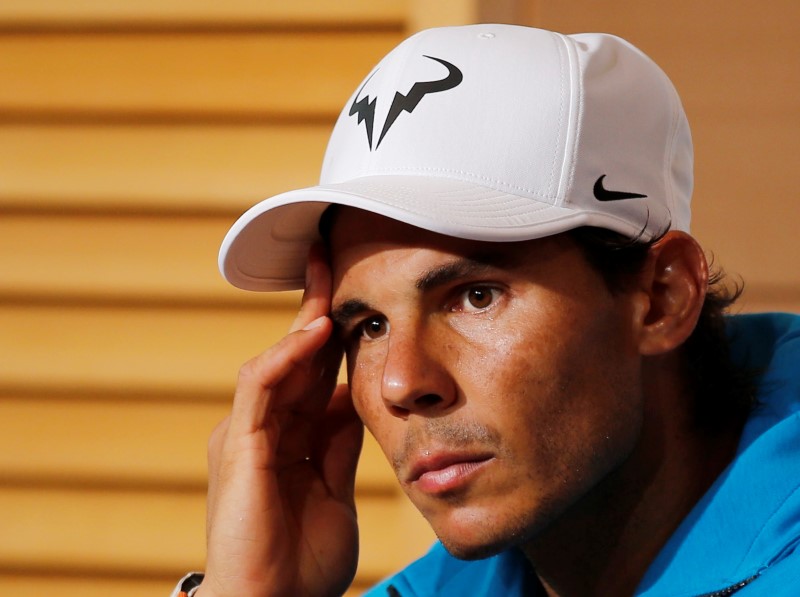 © Reuters. File photo of Rafael Nadal attending a news conference after being defeated by Novak Djokovic of Serbia during their men's quarter-final match at the French Open tennis tournament in Paris