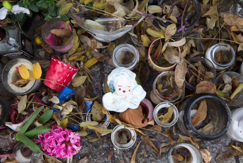 © Reuters. An ornament is seen at the makeshift memorial for the victims of the Paris attacks at the Bataclan concert hall in Paris