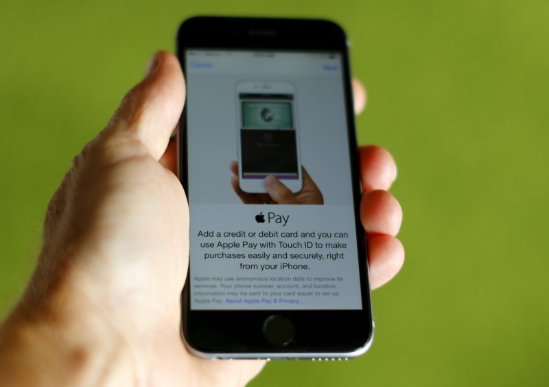 © Reuters. An Apple iphone 6 with Apple Pay is shown in this photo illustration in Encinitas , California 