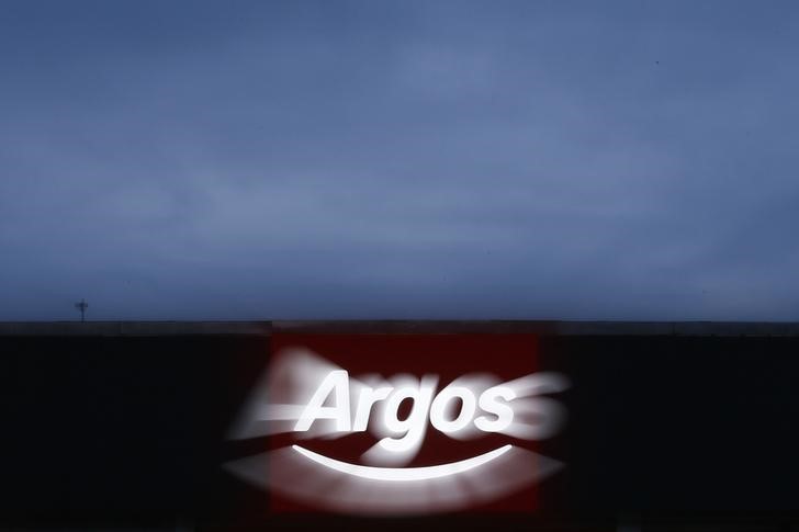 © Reuters. An illuminated sign is seen at an Argos store in London