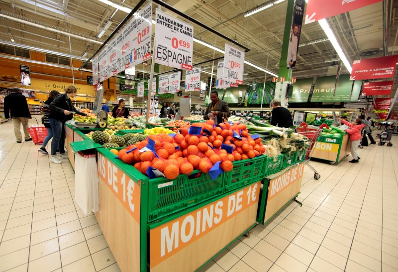 © Reuters. The slogan "Less than one Euro" is seen at the fruits and vegetables section of an Auchan supermarket in Nice,