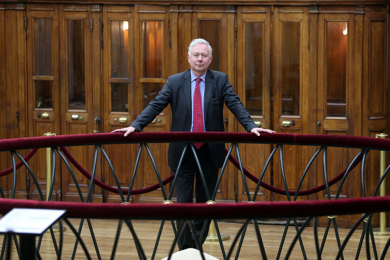 © Reuters. Arnaud de Bresson, CEO of Paris Europlace, poses inside the Palais Brongniart, former Paris Stock Exchange, in Paris