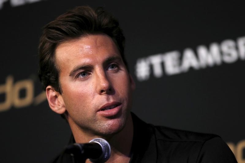 © Reuters. Olympic swimmer Grant Hackett of Australia speaks at a news conference at an event to unveil the new line of Speedo LZR Racer X swim suits inNew York