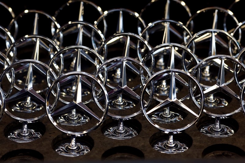 © Reuters. Car bonnet emblems for Mercedes-Benz S-class models are pictured at a plant in Sindelfingen