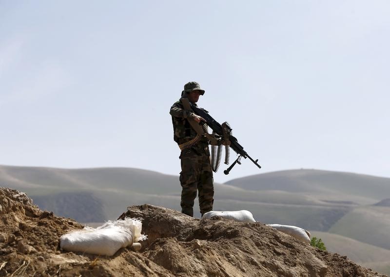 © Reuters. An Afghan National Army (ANA) soldier keeps watch during a patrol in Dand Ghori district of Baghlan 