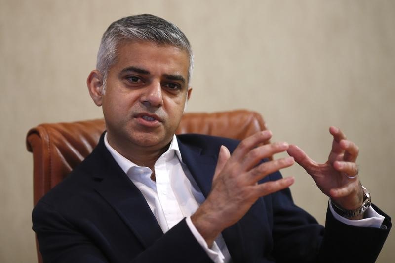 © Reuters. London mayoral candidate Khan gestures during an interview with Reuters at Canary Wharf in London