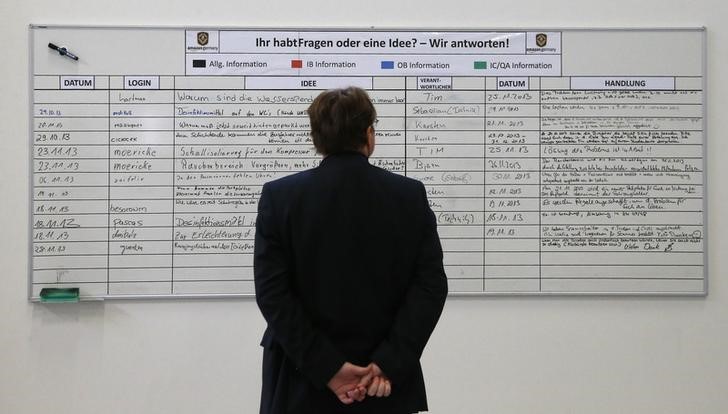 © Reuters. A man reads the suggestion board at Amazon's new distribution center in Brieselang