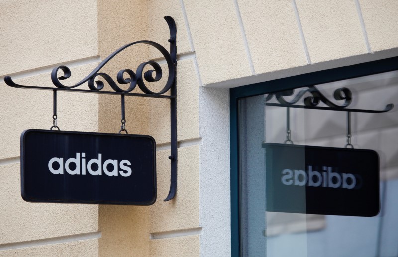 © Reuters. A board with Adidas store logo is seen on a shopping center at the outlet village Belaya Dacha outside Moscow