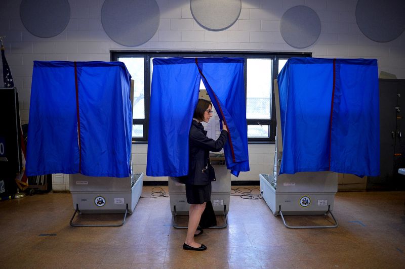 © Reuters. File photo of a voter leaving the booth after casting her ballot in the Pennsylvania primary at a polling place in Philadelphia