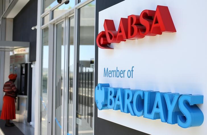 © Reuters. A woman uses an ATM at a branch of Barclays South African subsidiary Absa bank