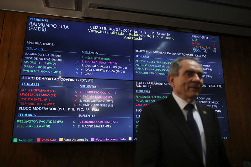 © Reuters. Senator Raimundo Lira, president of a special senate committee that will consider Brazil's President Dilma Rousseff's impeachment, is pictured in front of the voting panel in Brasilia