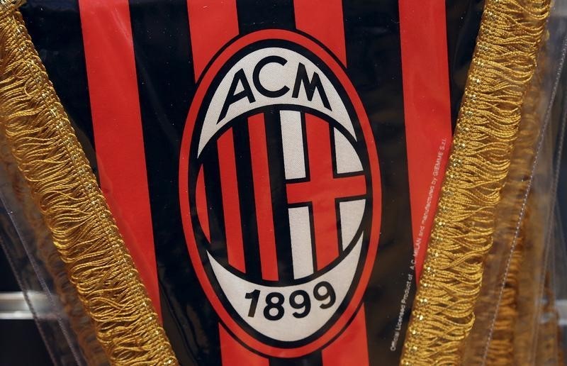 © Reuters. The AC Milan logo is pictured on a pennant in a soccer store downtown Milan