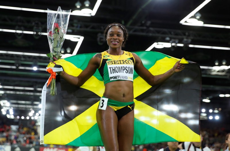 © Reuters. Thompson of Jamaica celebrates her bronze medal finish in the women's 60 meters final during the IAAF World Indoor Athletics Championships in Portland