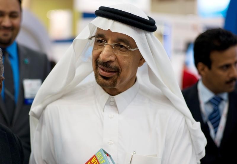 © Reuters. Khalid al-Falih speaks to the media at the company's booth during Petrotech 2014 in Manama