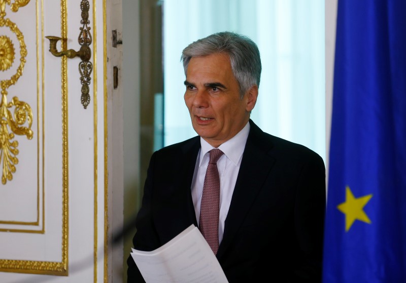© Reuters. Austria's Chancellor Faymann arrives for a news conference in Vienna