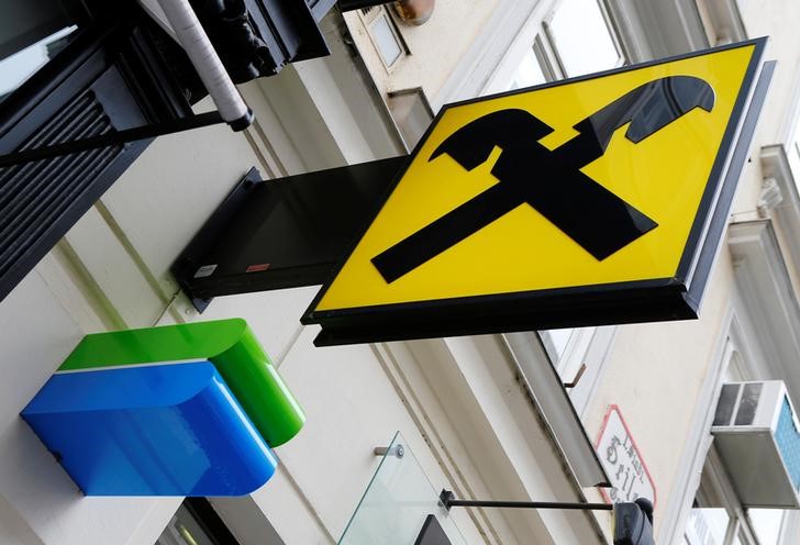 © Reuters. The logos of Bankomat cash machines and Raiffeisen are seen at a Raiffeisen bank branch office in Vienna