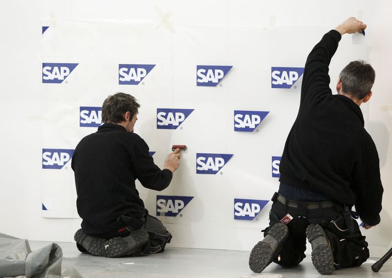 © Reuters. File photo of workers afixing signs of SAP at CeBIT in Hanover