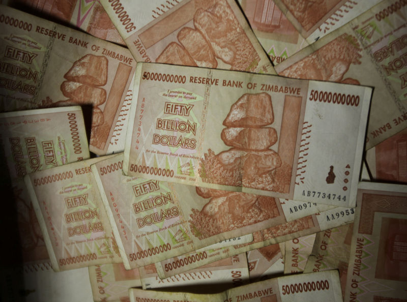 © Reuters. Fifty billion Zimbabwe dollar notes are seen in a vendor's basket in Harare