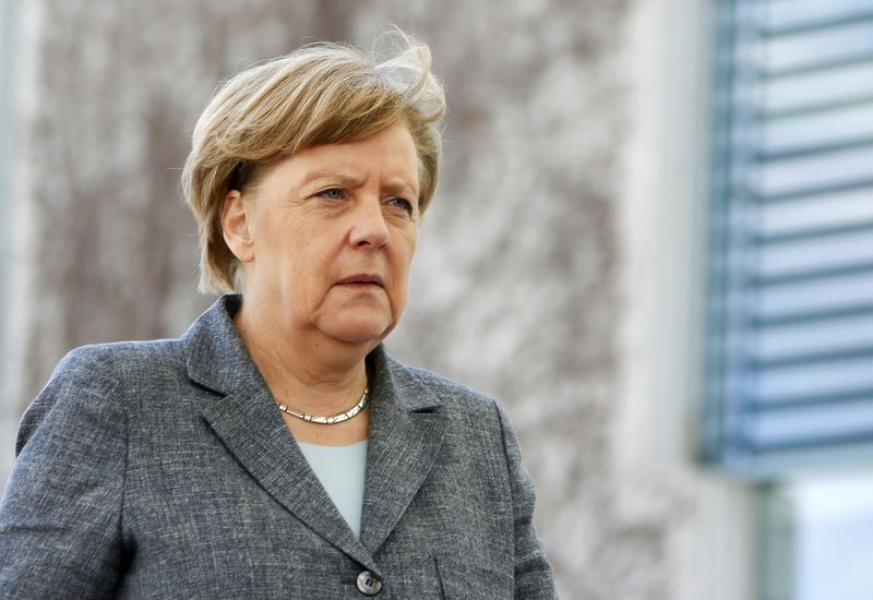 © Reuters. German Chancellor Merkel walks at the Chancellery in Berlin