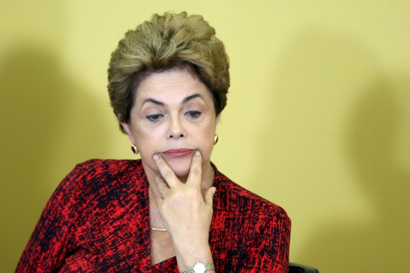 © Reuters. Brazil's President Dilma Rousseff reacts as she attends a signing ceremony for new universities, at Planalto Palace in Brasilia