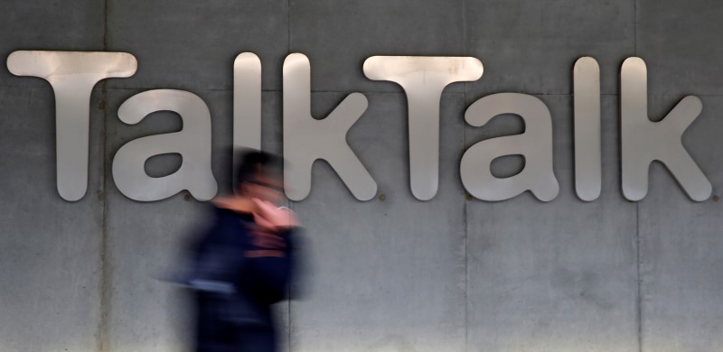 © Reuters. File photograph of a man walking past a company logo outside a TalkTalk building in London