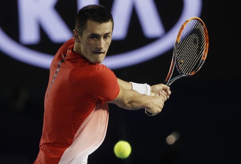 © Reuters. Australia's Tomic hits a shot during his third round match against compatriot Millman at the Australian Open tennis tournament at Melbourne Park