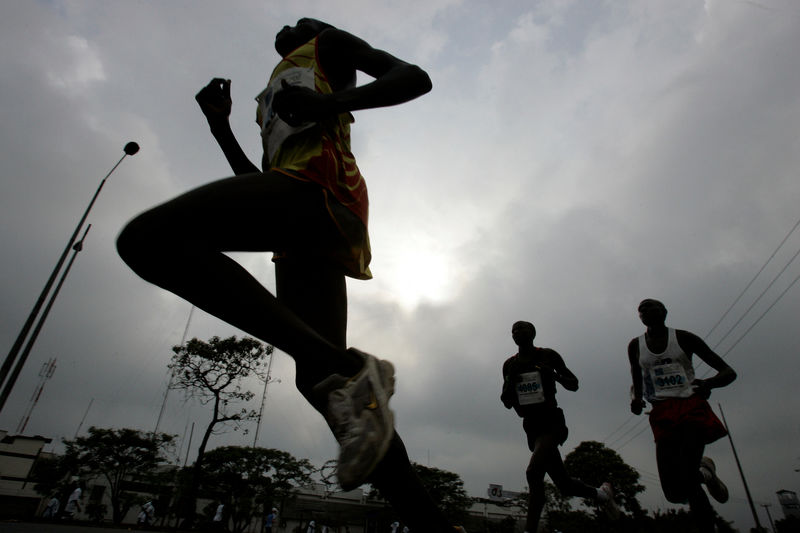 © Reuters. Athletes run during Nairobi Marathon 2008 in the outskirts of Nairobi