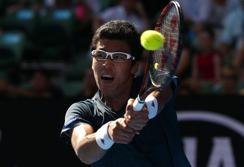 © Reuters. South Korea's Chung hits a shot during his first round match against Serbia's Djokovic at the Australian Open tennis tournament at Melbourne Park, Australia