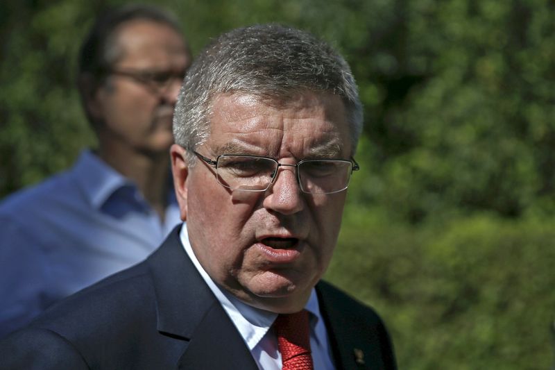 © Reuters. International Olympic Committee (IOC) President Bach talks to journalists following a wreath-laying ceremony at the monument of Pierre de Coubertin at the site of ancient Olympia